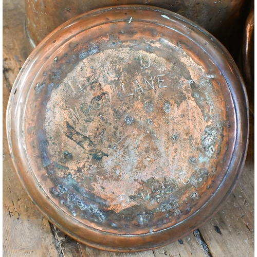 35 - Two antique copper milk churns and covers, one branded for United Dairies, the other for Percy Churc... 