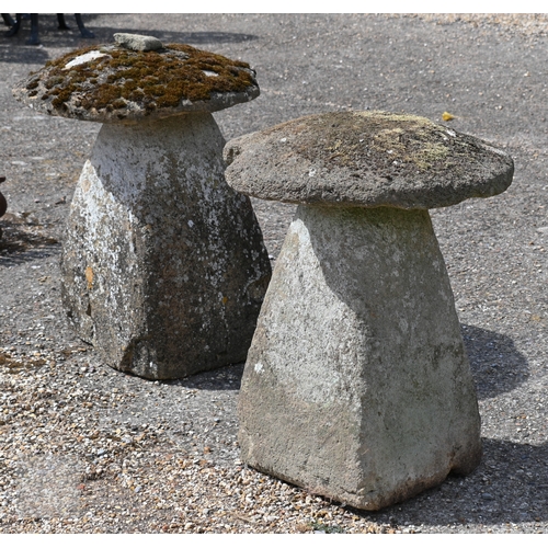 4 - Two large antique square tapering cut staddle stones with circular caps, weathered and usual superfi... 
