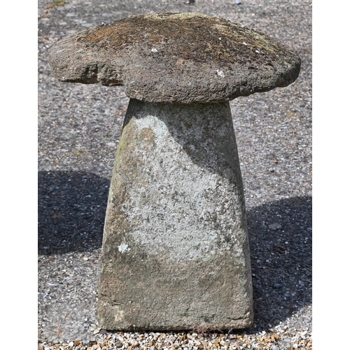 4 - Two large antique square tapering cut staddle stones with circular caps, weathered and usual superfi... 