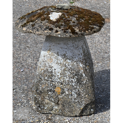 4 - Two large antique square tapering cut staddle stones with circular caps, weathered and usual superfi... 