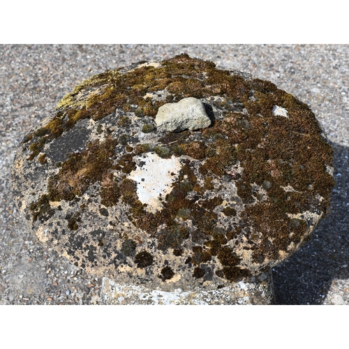 4 - Two large antique square tapering cut staddle stones with circular caps, weathered and usual superfi... 
