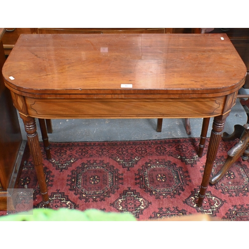 40 - A Victorian inlaid mahogany fold-over double gateleg tea table, raised on gadrooned turned supports