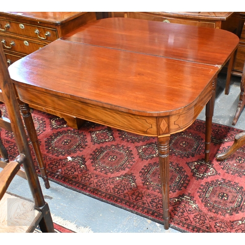 40 - A Victorian inlaid mahogany fold-over double gateleg tea table, raised on gadrooned turned supports