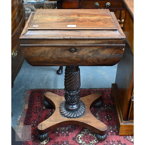 42 - A Regency figured mahogany sarcophagus form teapoy, the interior with four canisters flanking twin c... 