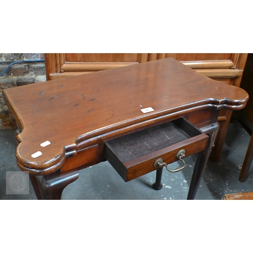 43 - A Georgian style mahogany fold-over gateleg card table. with lobed corners over a frieze drawer, rai... 