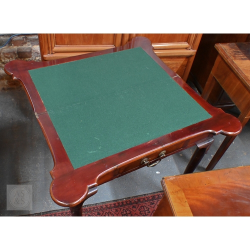 43 - A Georgian style mahogany fold-over gateleg card table. with lobed corners over a frieze drawer, rai... 