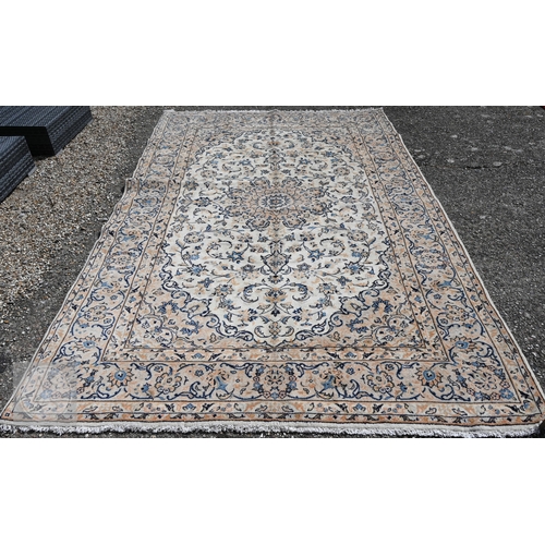 464 - A central Persian Kashan carpet, the ivory ground with trailing flowering vines in blues, 313 cm x 2... 