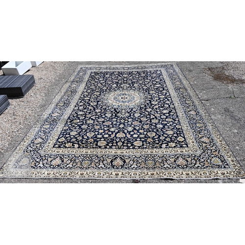 465 - A contemporary central Persian Kashan carpet, signed by the weaver, the blue ground with flowering v...