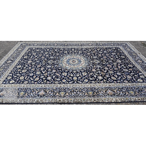 465 - A contemporary central Persian Kashan carpet, signed by the weaver, the blue ground with flowering v... 