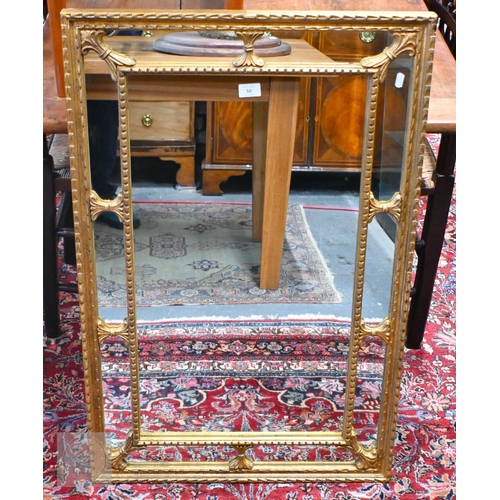 50 - A vintage Chippendale style gilt cushion framed mirror, 64 cm x 98 cm