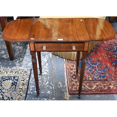 53 - A small Victorian mahogany drop leaf occasional table, with frieze drawer and raised on turned suppo... 