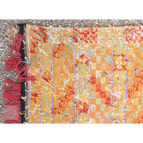 56 - A vintage handloomed Portuguese 'Turkish Soumak' design rug, in soft multi-colours, 180 cm x 106 cm