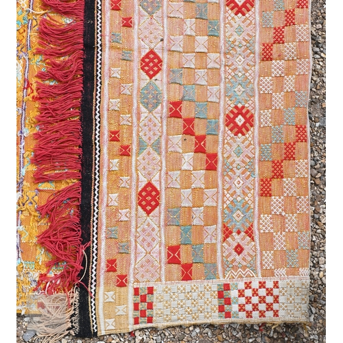 56 - A vintage handloomed Portuguese 'Turkish Soumak' design rug, in soft multi-colours, 180 cm x 106 cm