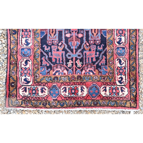 60 - A contemporary Persian Navahand/Hamadan wide runner, the geometric design on blue/crimson ground, 29... 
