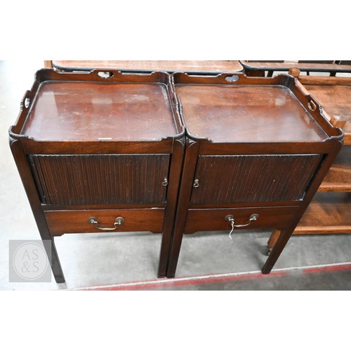 174 - A pair of George III style mahogany tray top step commodes, with opposing tambour doors over green s... 