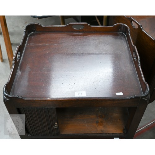 174 - A pair of George III style mahogany tray top step commodes, with opposing tambour doors over green s... 