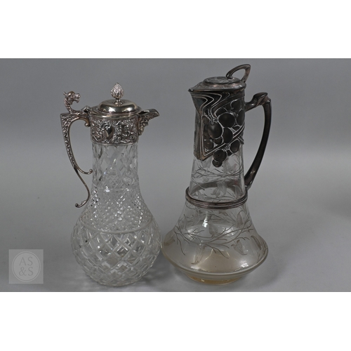 1 - A heavy quality cut glass claret jug with embossed and chased silver collar, cover and handle, C J V... 