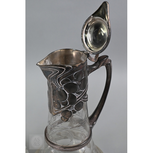 1 - A heavy quality cut glass claret jug with embossed and chased silver collar, cover and handle, C J V... 