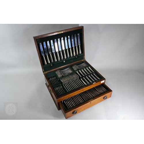 209 - An oak canteen, fitted with an extensive set of silver Hanoverian rat-tail flatware and cutlery with...