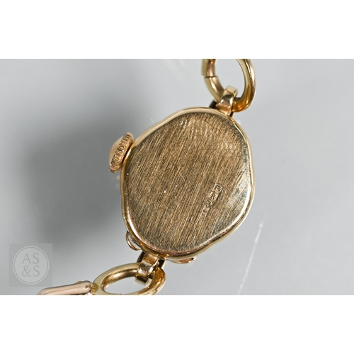 273 - A 9ct yellow gold lady's wristwatch with bracelet strap, a Sekonda watch face, enamelled religious p... 