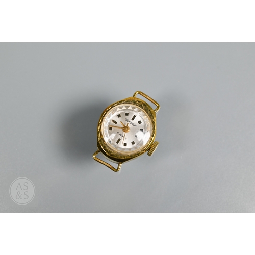 273 - A 9ct yellow gold lady's wristwatch with bracelet strap, a Sekonda watch face, enamelled religious p... 