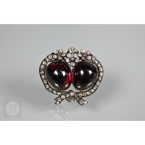 274 - A Victorian suite of three diamond and garnet brooches, the centrepiece comprising two cabochon garn... 