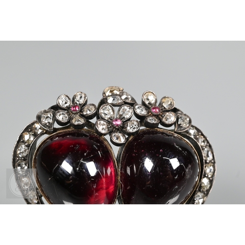 274 - A Victorian suite of three diamond and garnet brooches, the centrepiece comprising two cabochon garn... 