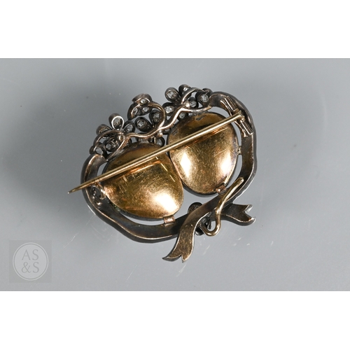 274 - A Victorian suite of three diamond and garnet brooches, the centrepiece comprising two cabochon garn... 