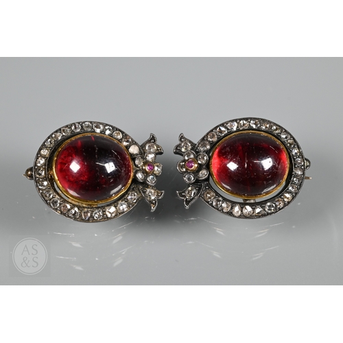 274 - A Victorian suite of three diamond and garnet brooches, the centrepiece comprising two cabochon garn... 