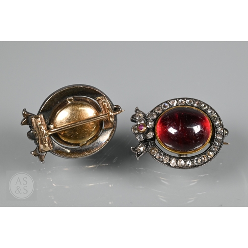 274 - A Victorian suite of three diamond and garnet brooches, the centrepiece comprising two cabochon garn... 