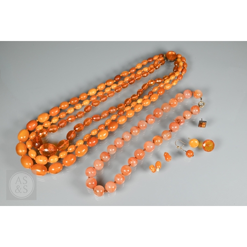 275 - A triple row of graduated amber beads, comprising two 'butterscotch opaque' and one faceted, double ... 