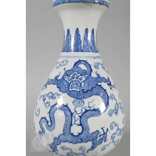 338 - A 19th century Chinese blue and white pear-shaped vase, late Qing period, painted in underglaze blue... 