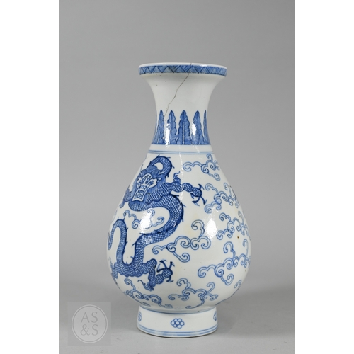338 - A 19th century Chinese blue and white pear-shaped vase, late Qing period, painted in underglaze blue... 