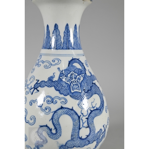 338 - A 19th century Chinese blue and white pear-shaped vase, late Qing period, painted in underglaze blue... 
