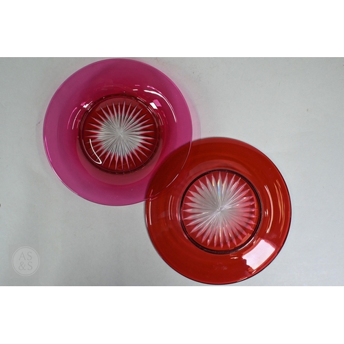 469 - A set of nine 19th Century cranberry glass champagne saucers with clear stems and ground-out pontil ... 