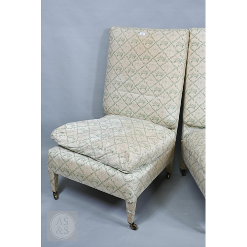 612 - A rare pair of generous high back open salon chairs by Portman Upholstery, London W1, upholstered in... 