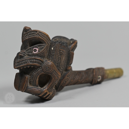 775 - An antique Maori pipe,&nbsp;carved wood with two Tane figures, one with cut paua shell eyes, grimacing ex...