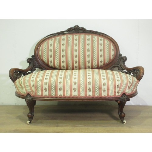 125 - A small Victorian walnut framed Settee on cabriole front legs and casters 3ft 10in W