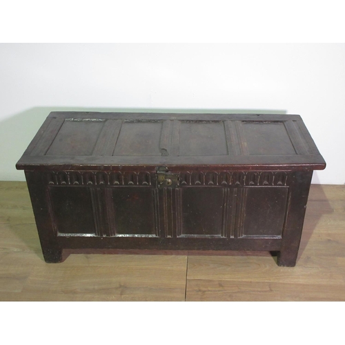 207 - A 17th Century oak Coffer, sunken four panel lid, four panel front, nulled carved frieze, later lock... 