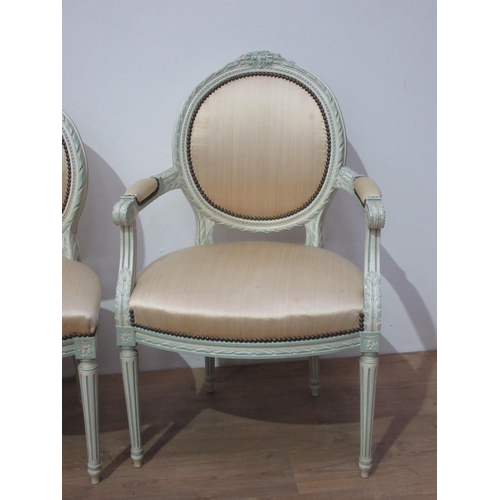 221 - A set of six French cream painted Salon Chairs with leafage carving and cream upholstery, mounted up... 