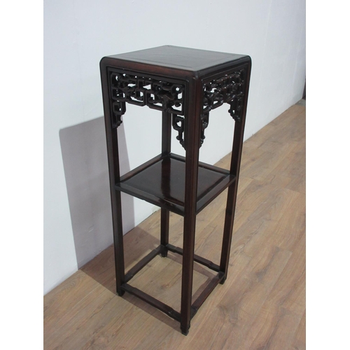 245 - A Chinese hardwood two tier Torchere Stand with pierced frieze mounted upon shaped square cut suppor... 