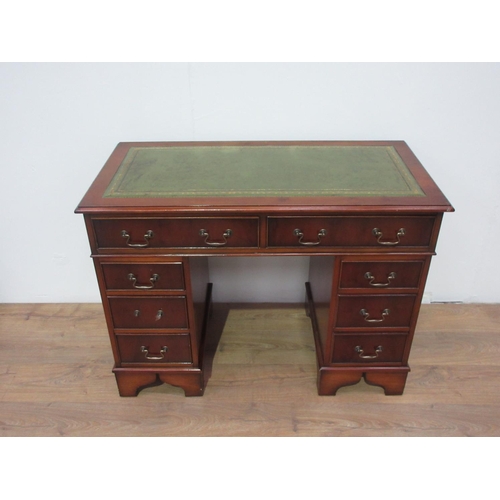 264 - A reproduction yewwood twin pedestal Writing Desk with leather inset top fitted eight drawers.