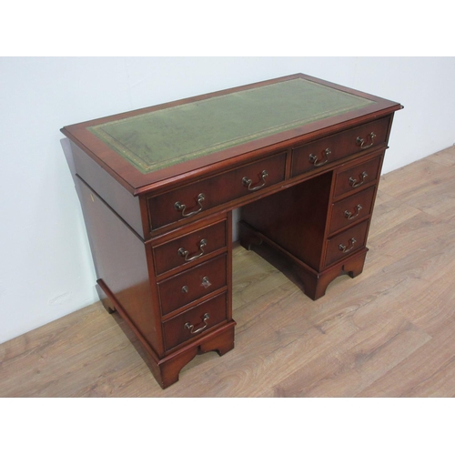 264 - A reproduction yewwood twin pedestal Writing Desk with leather inset top fitted eight drawers.