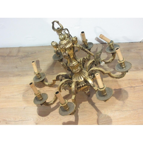 331 - A 19th Century cast brass eight branch Ceiling Light, the central baluster pillar above a circular t... 