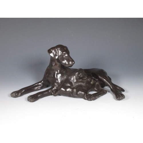 342 - A bronze patinated Figure of a labrador and pups 12in L.