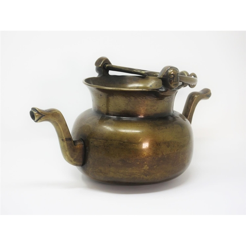 370 - A Dutch bronze 16th Century style Lavabo with spout, handle and mask decoration 1ft 3in W x 8in H.