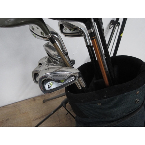 407 - A bag of Dunlop Golf Clubs with Trolley and an oil filled Radiator.