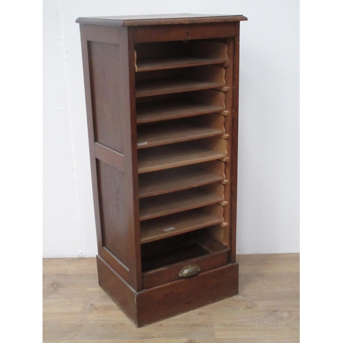 424 - An oak tambour fronted Filing Cabinet.