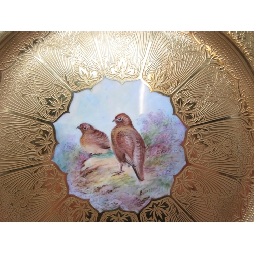 503 - A Royal Worcester Plate, predominantly gilded, with small panel of grouse, signed E. Townsend, 10 3/... 