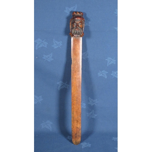 521 - An antique wooden Page Turner with carved head handle.